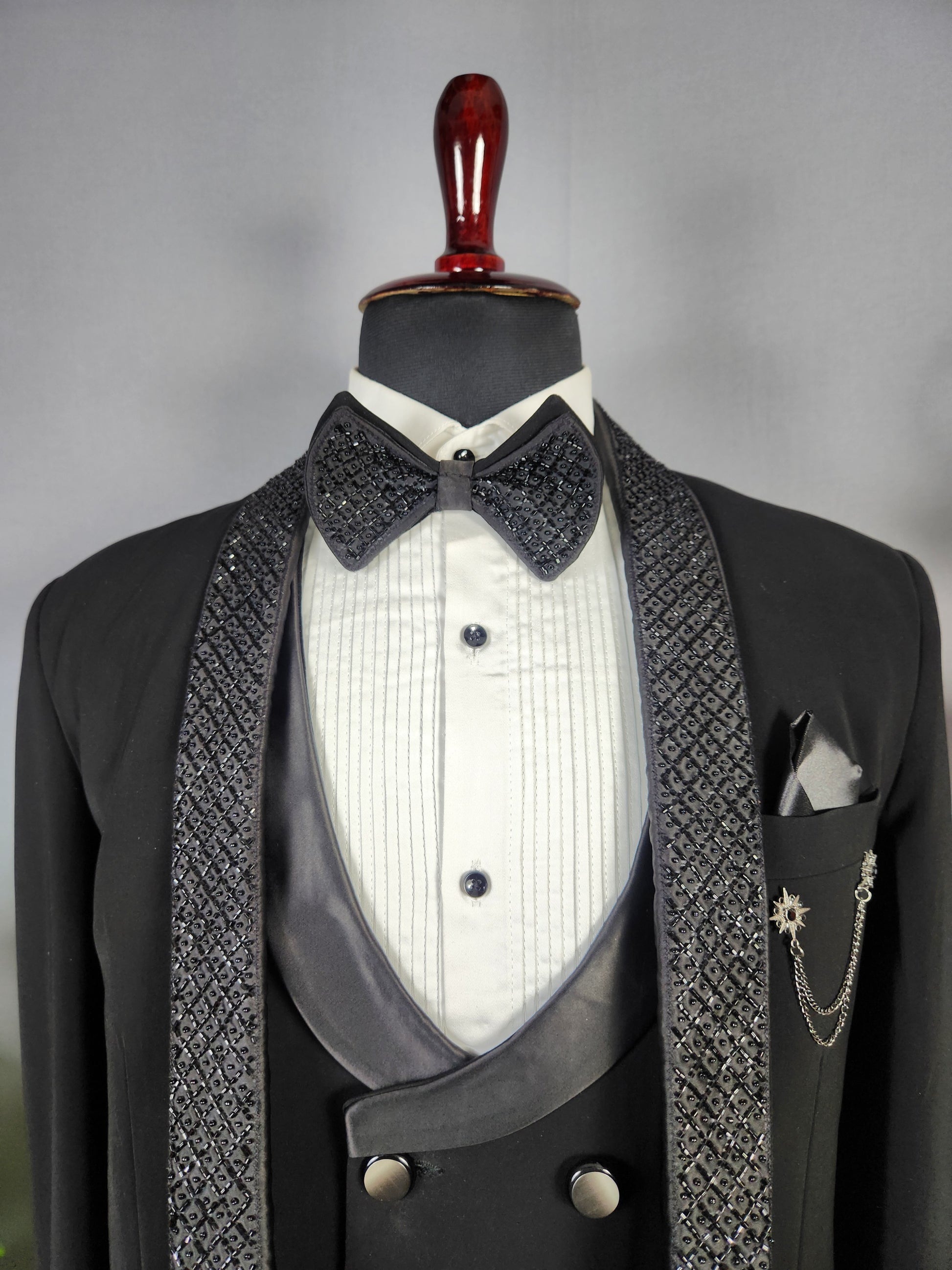 Men's black tuxedo suit for Indian groom, perfect for wedding and reception wear

