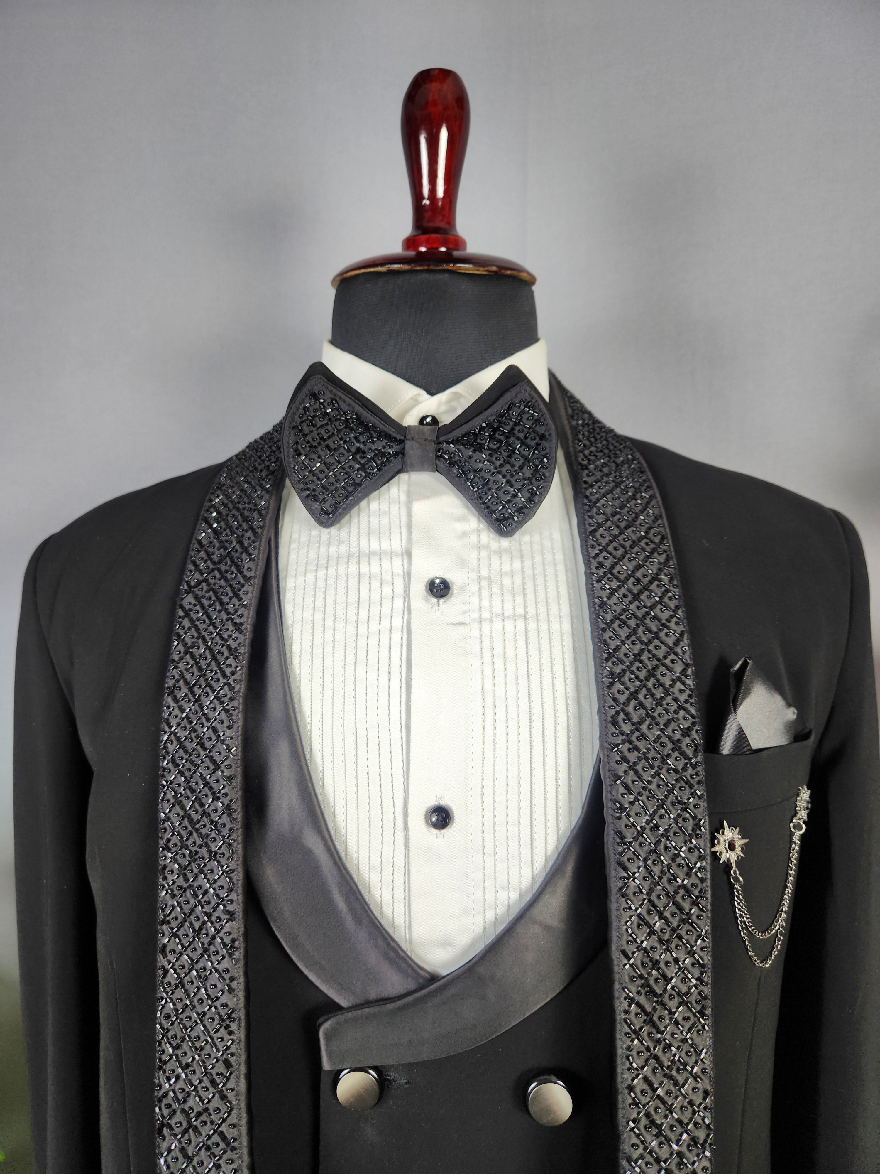 Men's black tuxedo suit for Indian groom, perfect for wedding and reception wear
