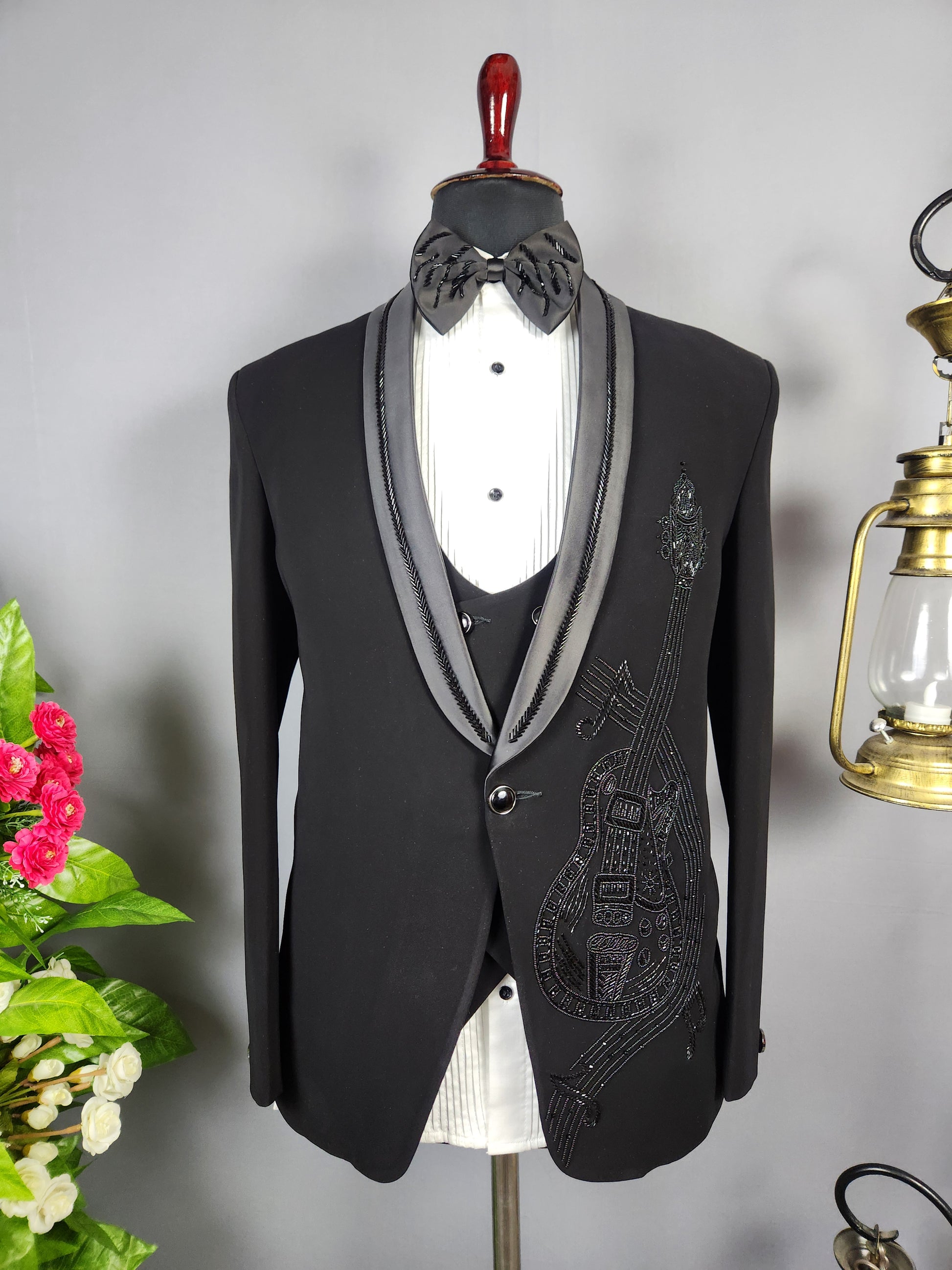 Men's black tuxedo suit for Indian groom, perfect for wedding and reception wear

