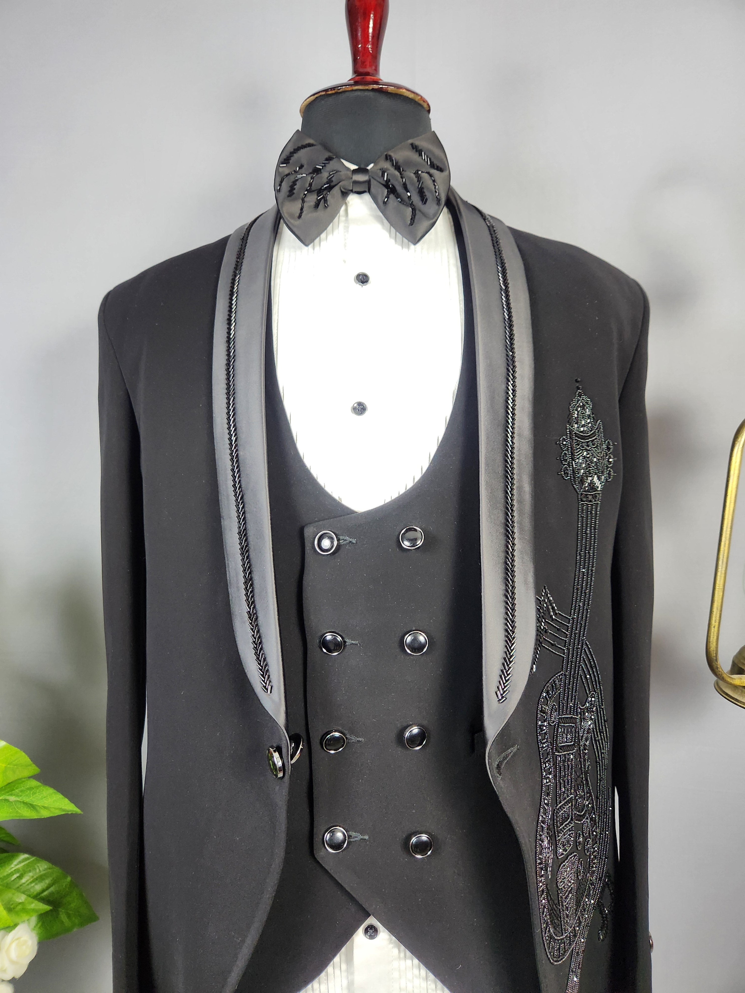 Men's black tuxedo suit for Indian groom, perfect for wedding and reception wear
