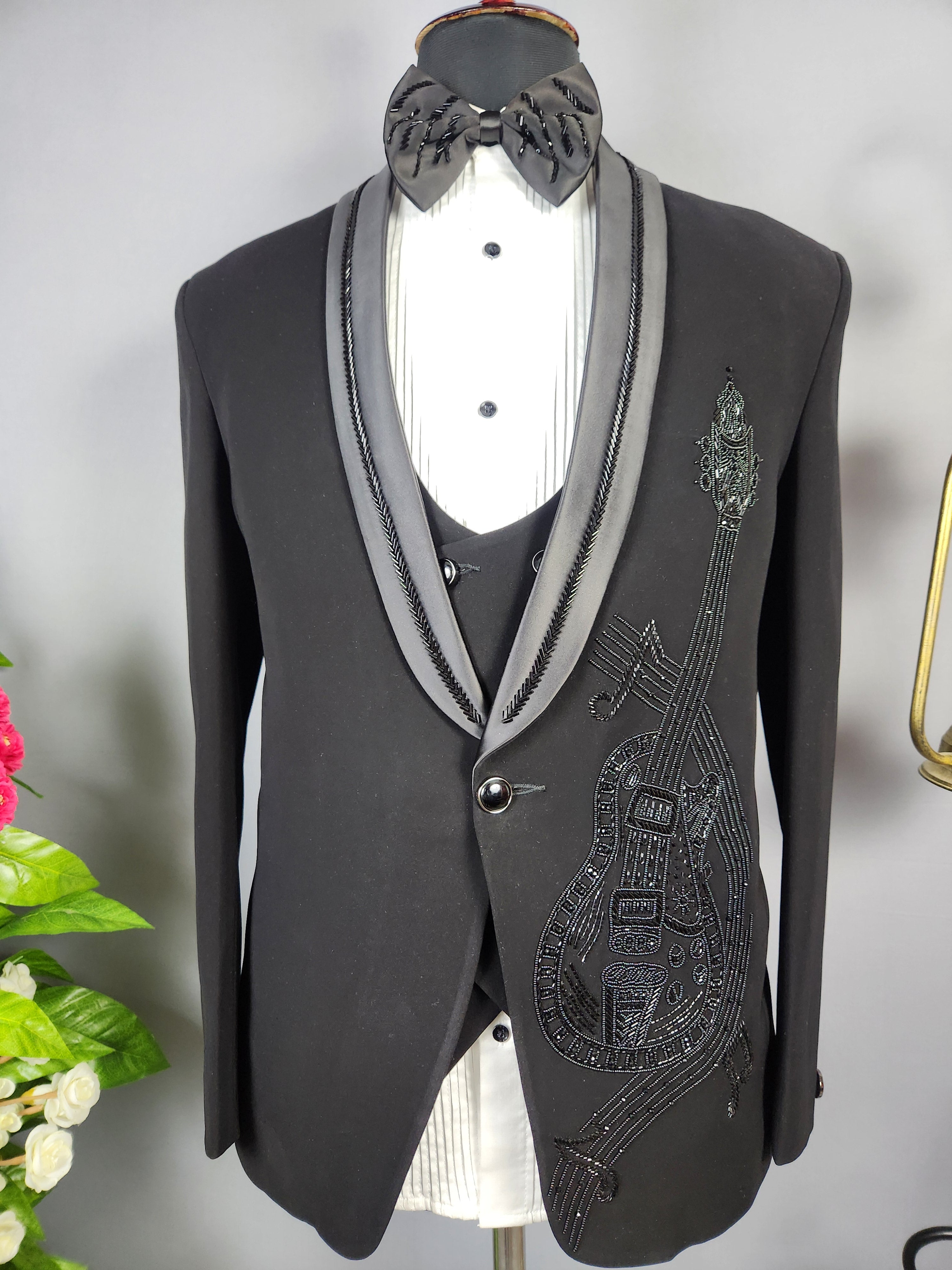 Men's black tuxedo suit for Indian groom, perfect for wedding and reception wear

