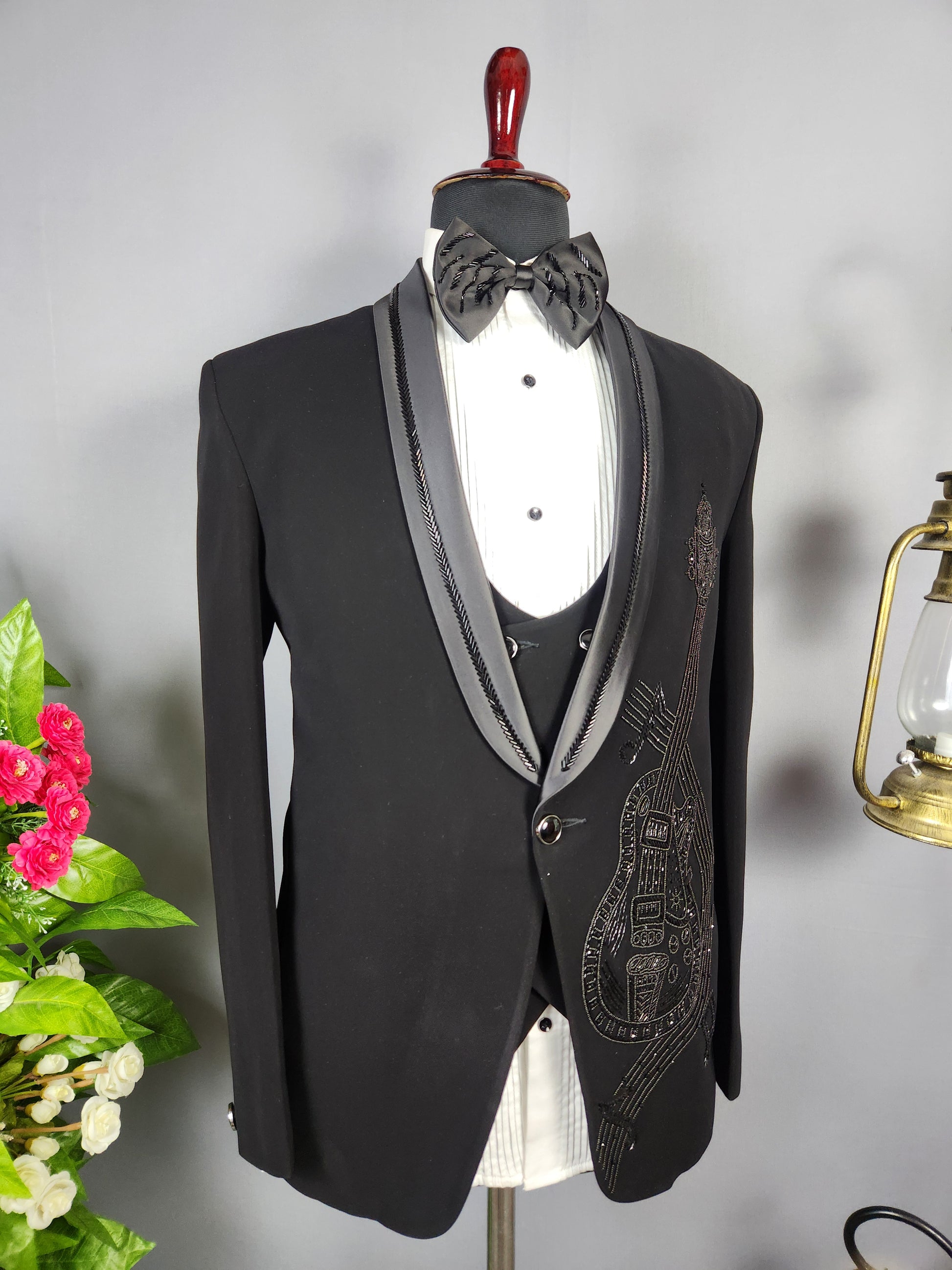 Men's black tuxedo suit for Indian groom, perfect for wedding and reception wear
