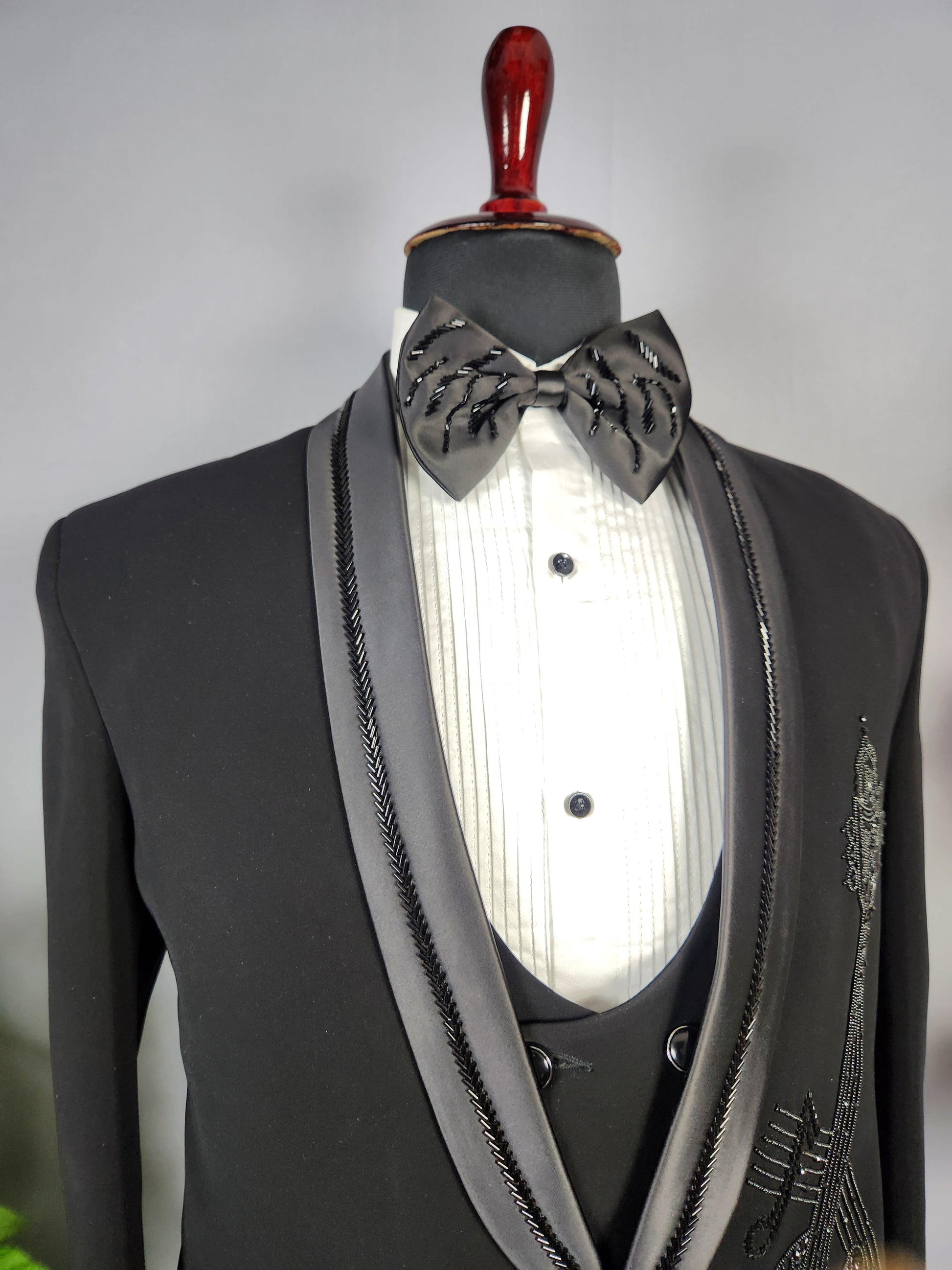 Men's black tuxedo suit for Indian groom, perfect for wedding and reception wear
