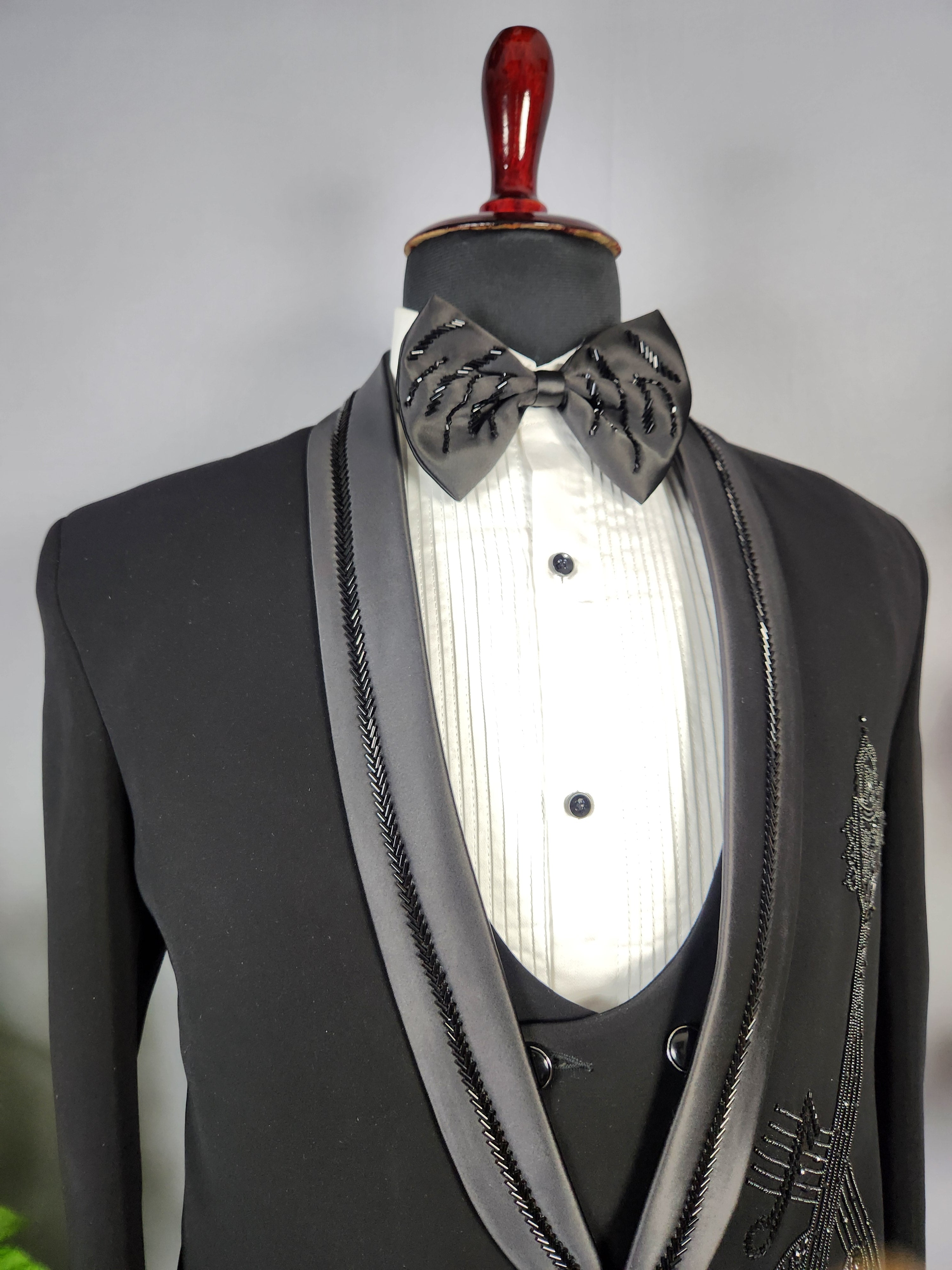 Men's black tuxedo suit for Indian groom, perfect for wedding and reception wear
