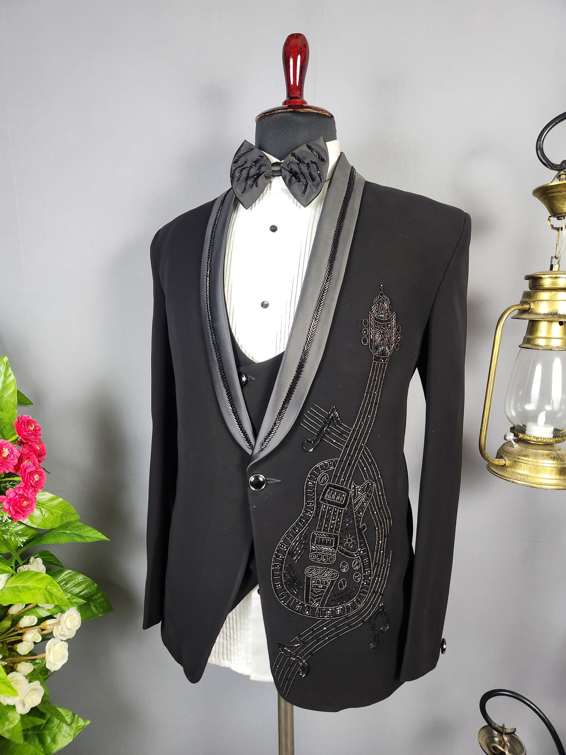 Men's black tuxedo suit for Indian groom, perfect for wedding and reception wear
