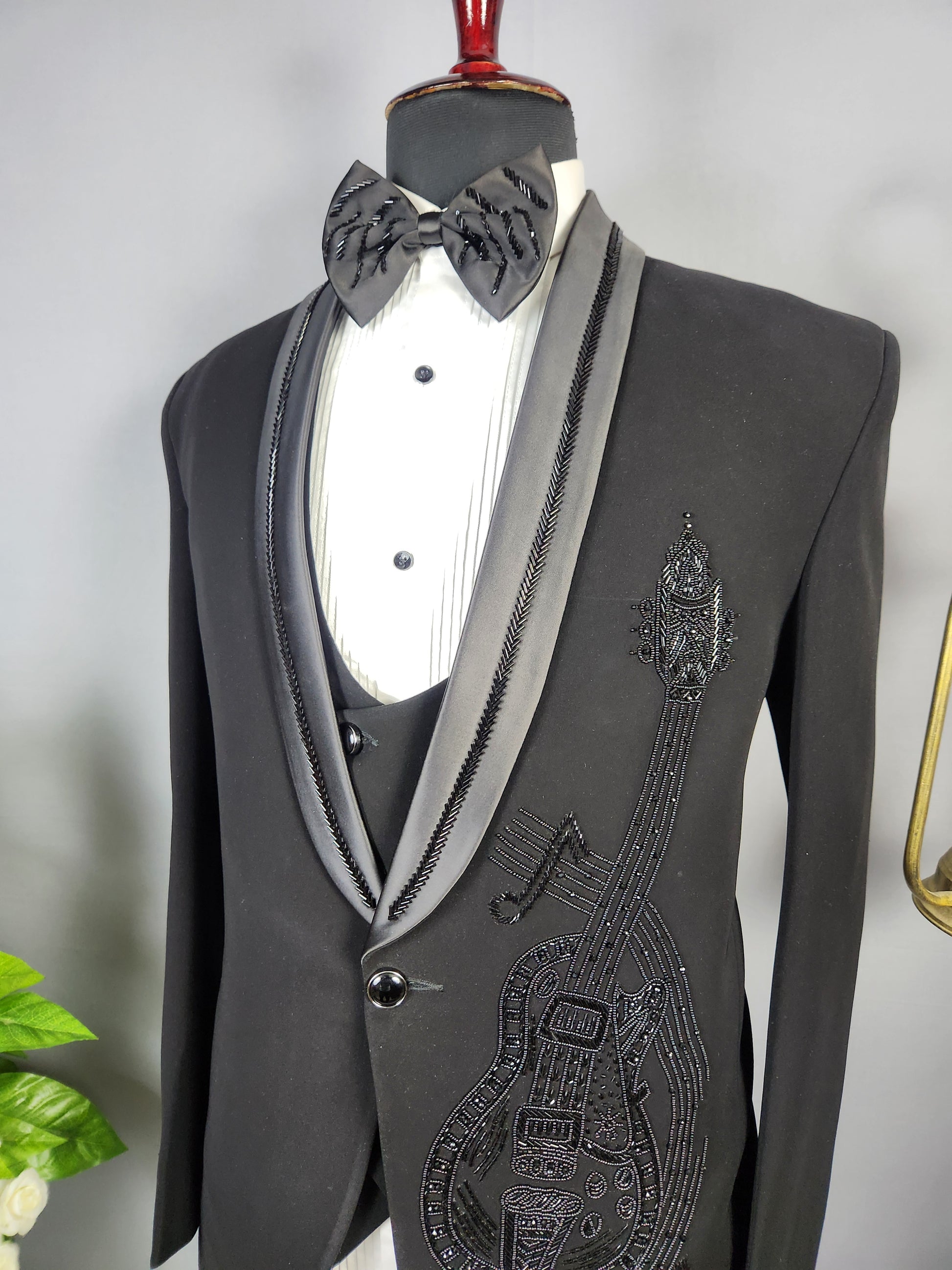 Men's black tuxedo suit for Indian groom, perfect for wedding and reception wear
