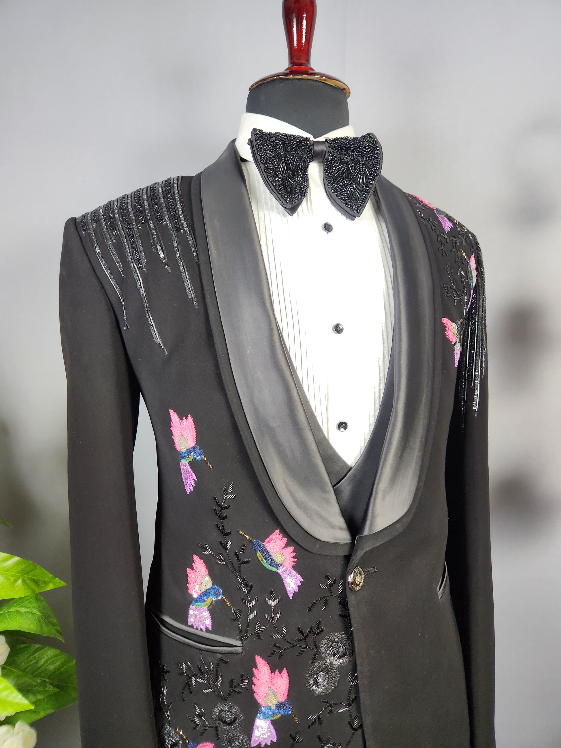Men's black tuxedo suit for Indian groom, perfect for wedding and reception wear
