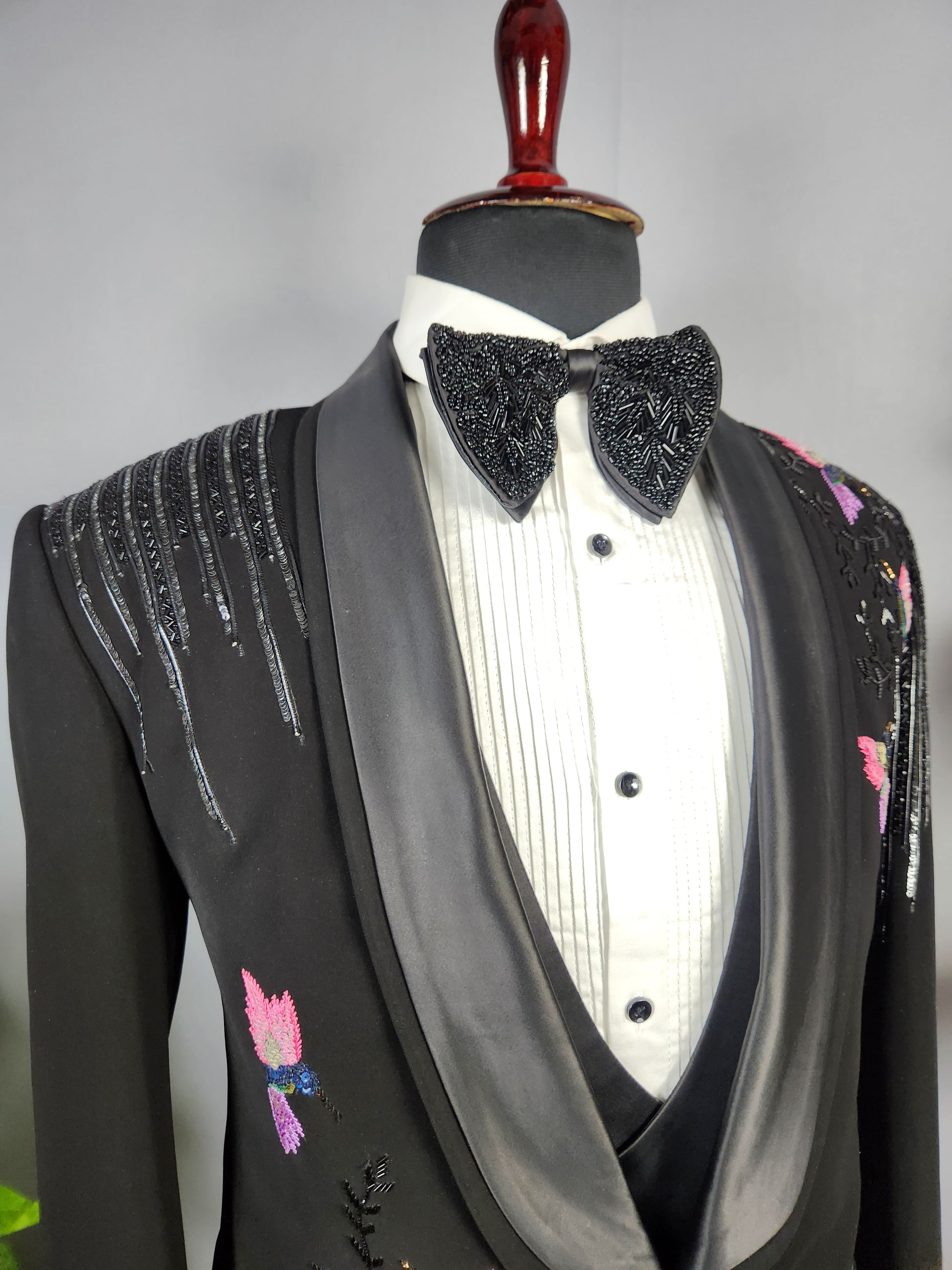 Men's black tuxedo suit for Indian groom, perfect for wedding and reception wear
