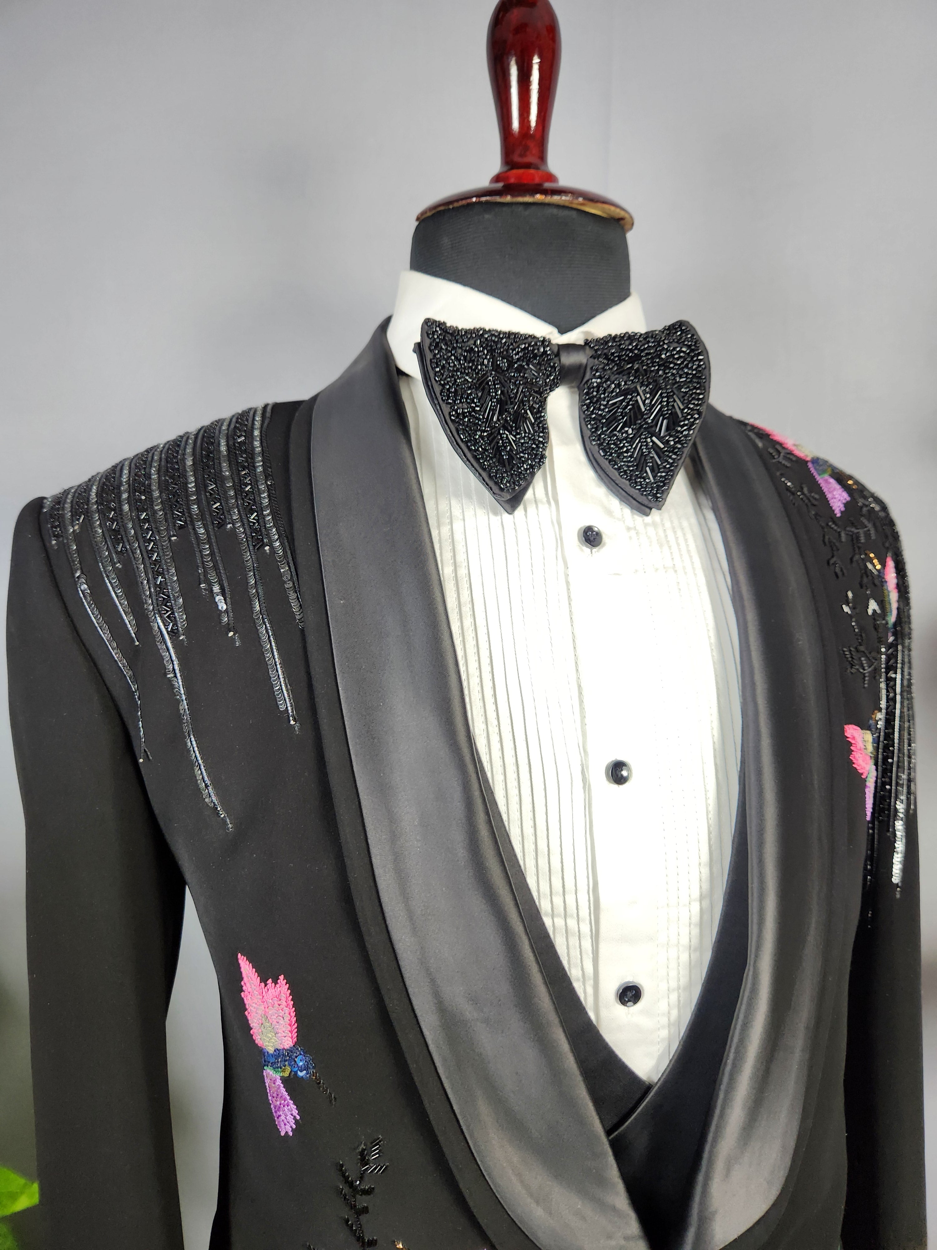 Men's black tuxedo suit for Indian groom, perfect for wedding and reception wear
