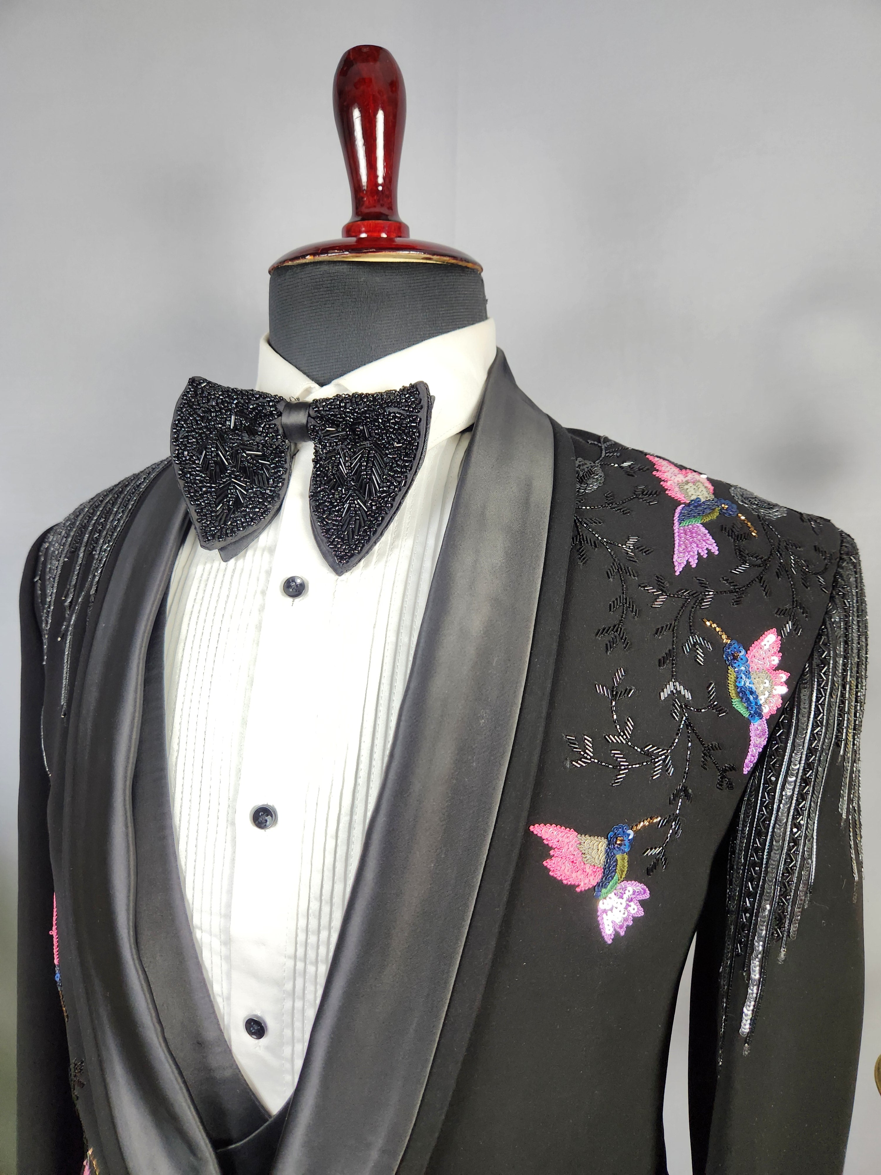 Men's black tuxedo suit for Indian groom, perfect for wedding and reception wear
