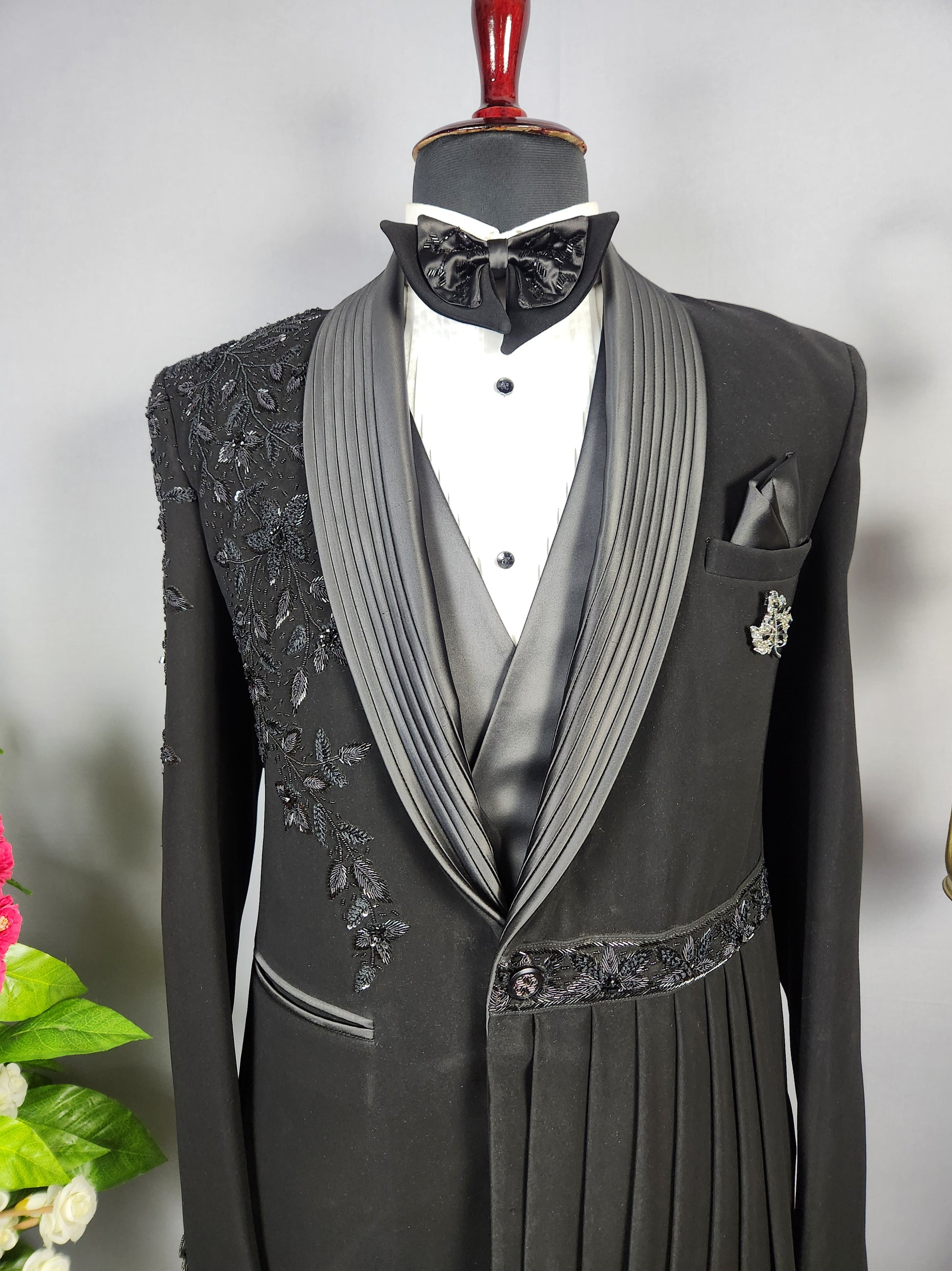 Men's black tuxedo suit for Indian groom, perfect for wedding and reception wear
