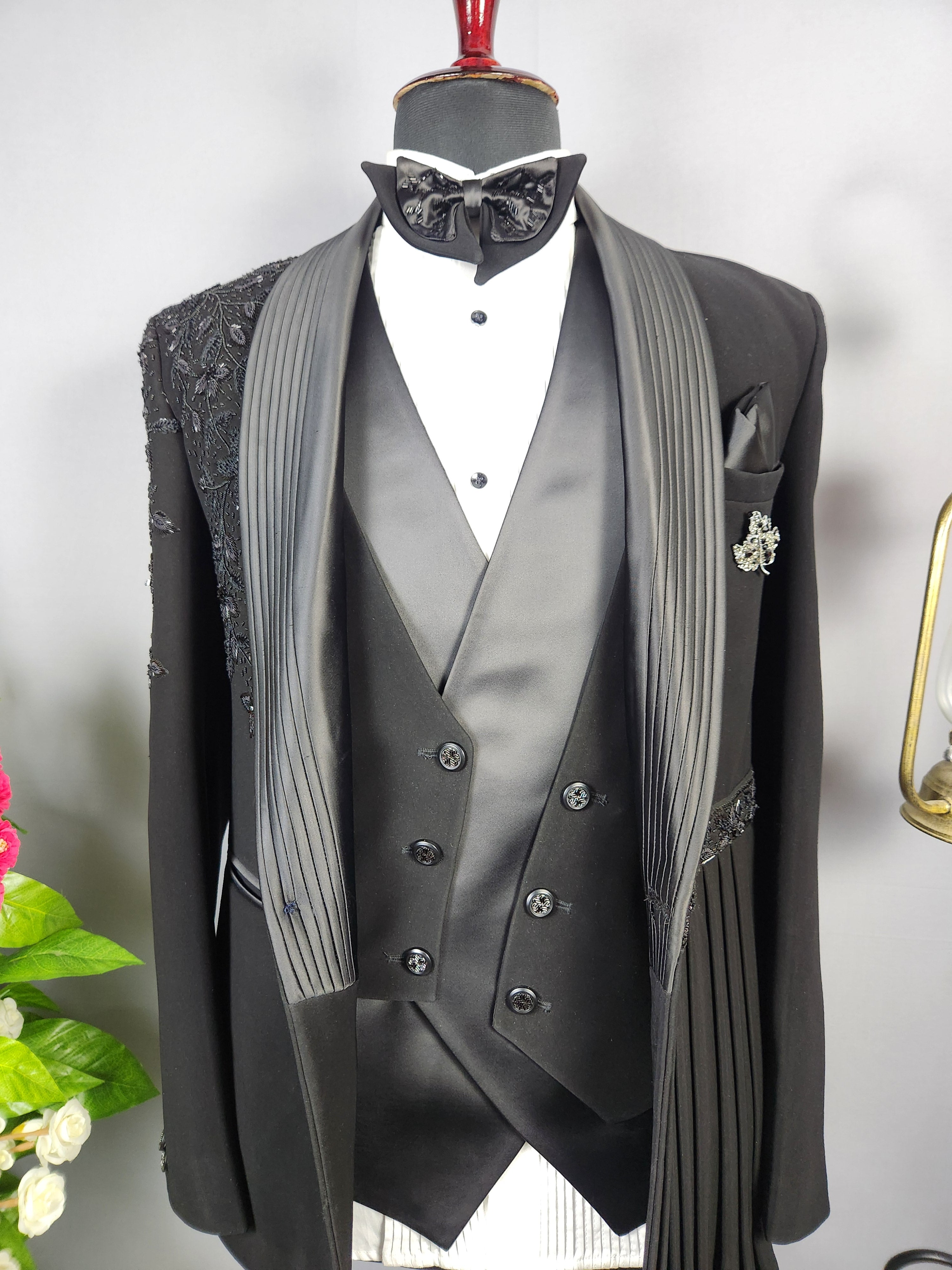 Men's black tuxedo suit for Indian groom, perfect for wedding and reception wear
