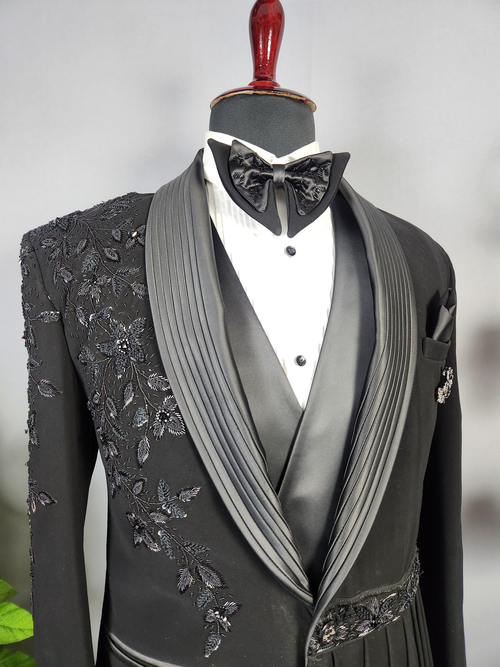 Men's black tuxedo suit for Indian groom, perfect for wedding and reception wear

