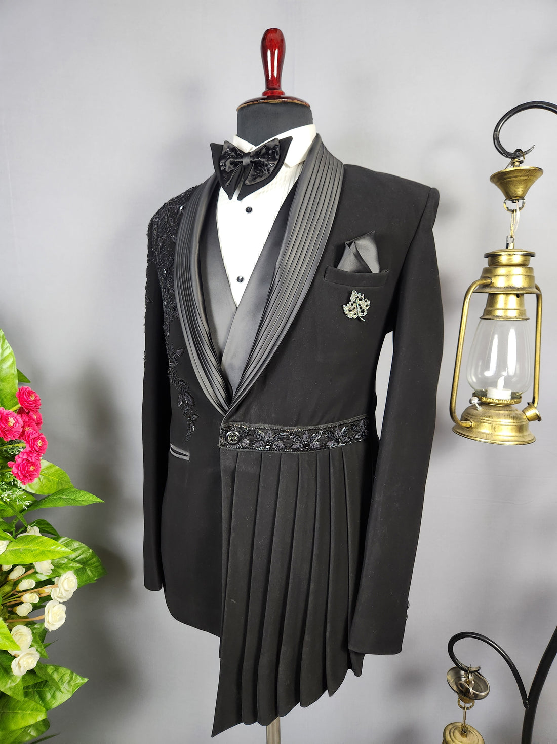 Men's black tuxedo suit for Indian groom, perfect for wedding and reception wear
