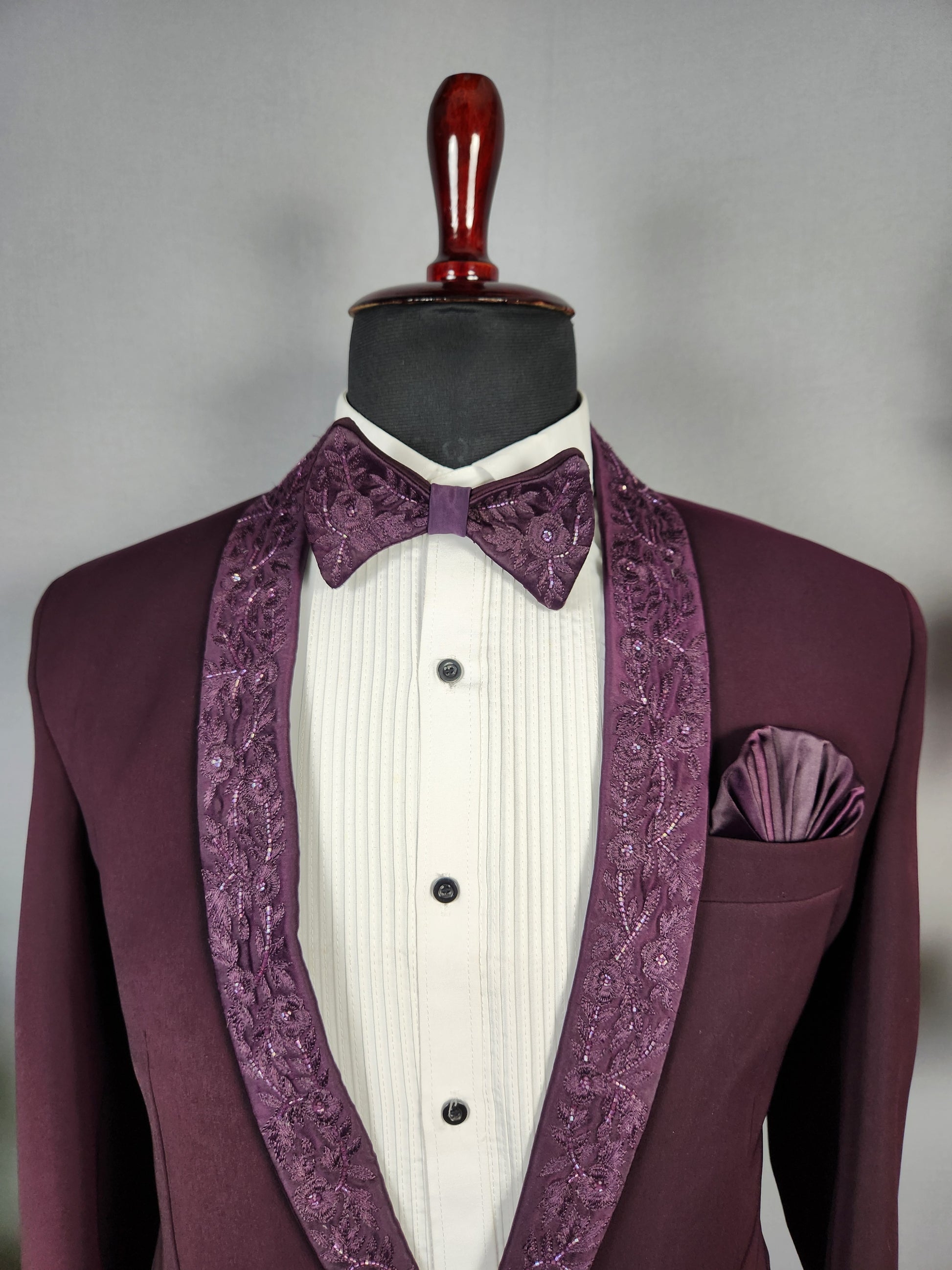 Men's dark plum tuxedo suit for Indian groom, perfect for wedding and reception wear
