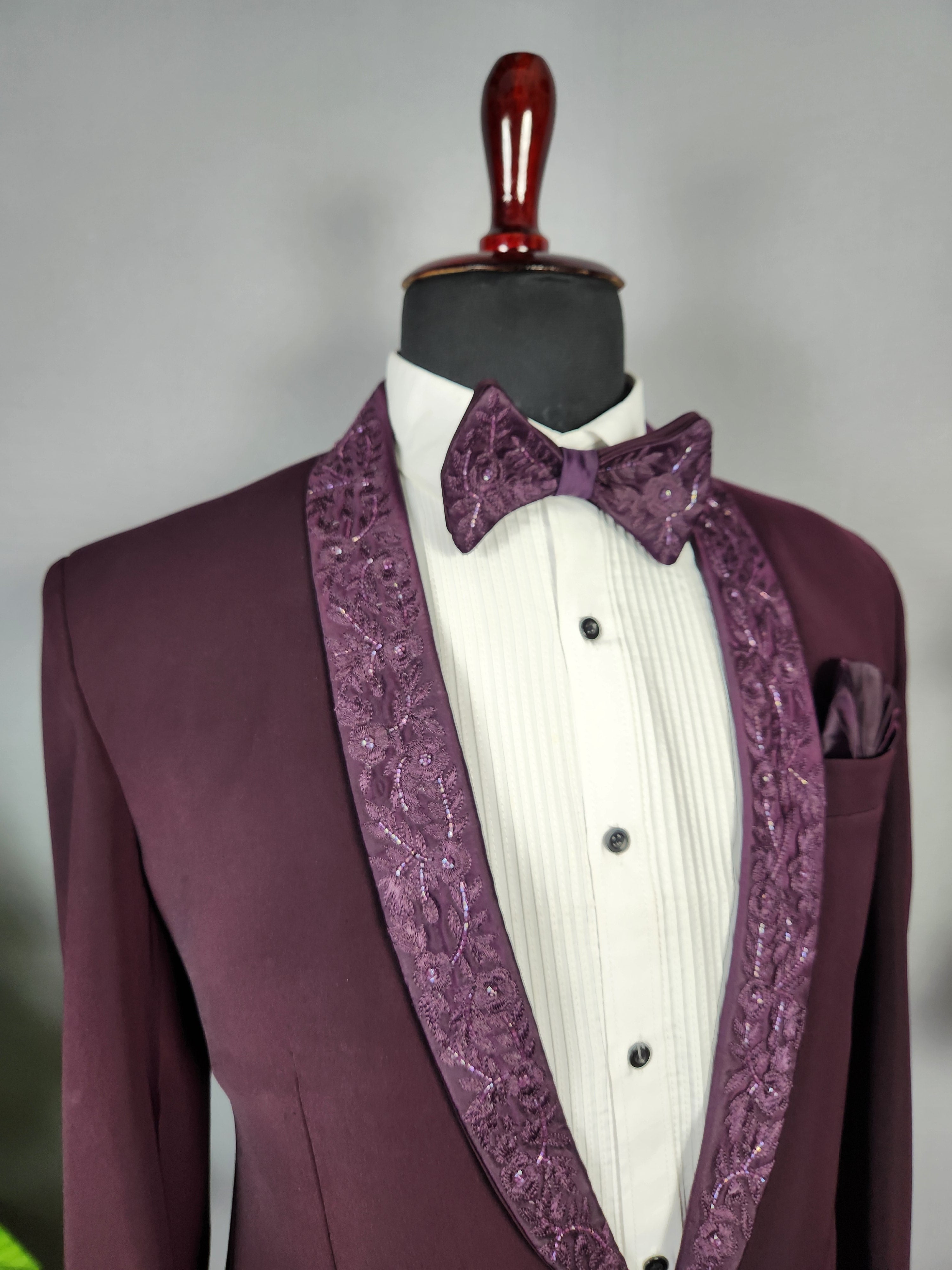 Men's dark plum tuxedo suit for Indian groom, perfect for wedding and reception wear
