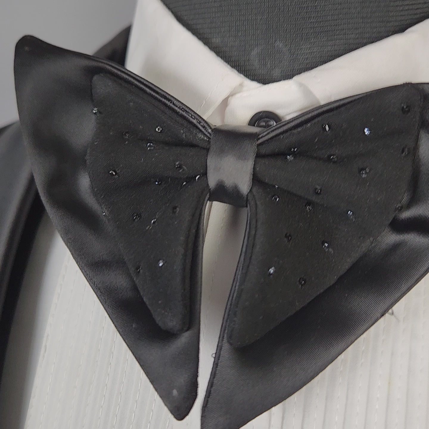 Men's black tuxedo suit for Indian groom, perfect for wedding and reception wear
