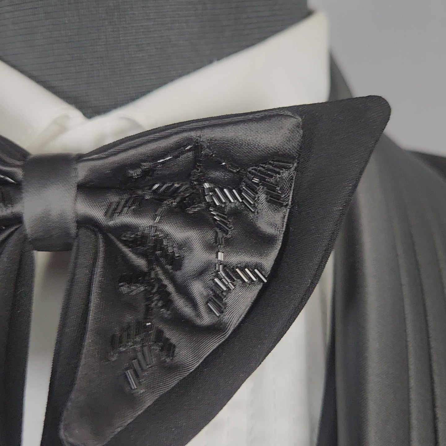 Men's black tuxedo suit for Indian groom, perfect for wedding and reception wear
