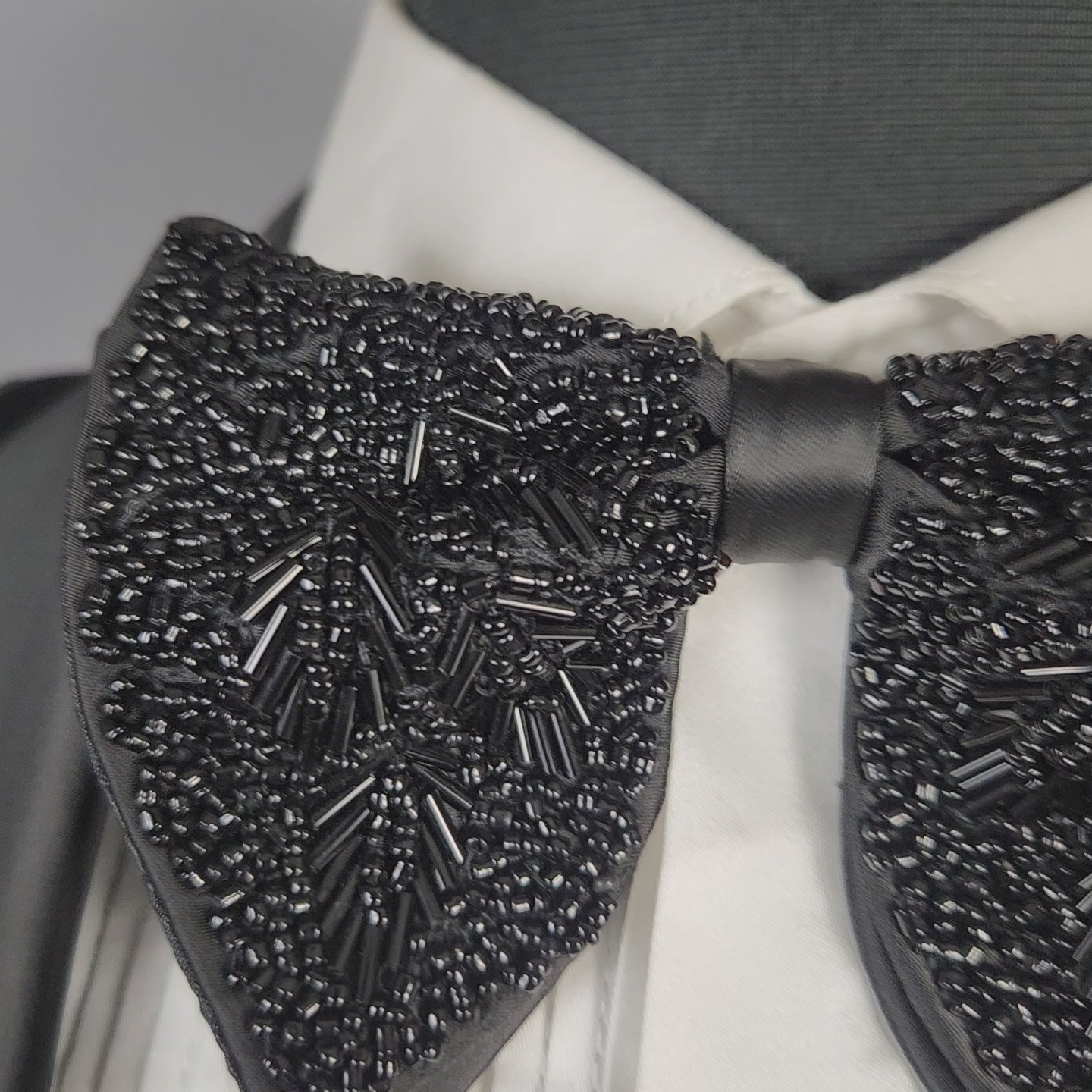 Men's black tuxedo suit for Indian groom, perfect for wedding and reception wear

