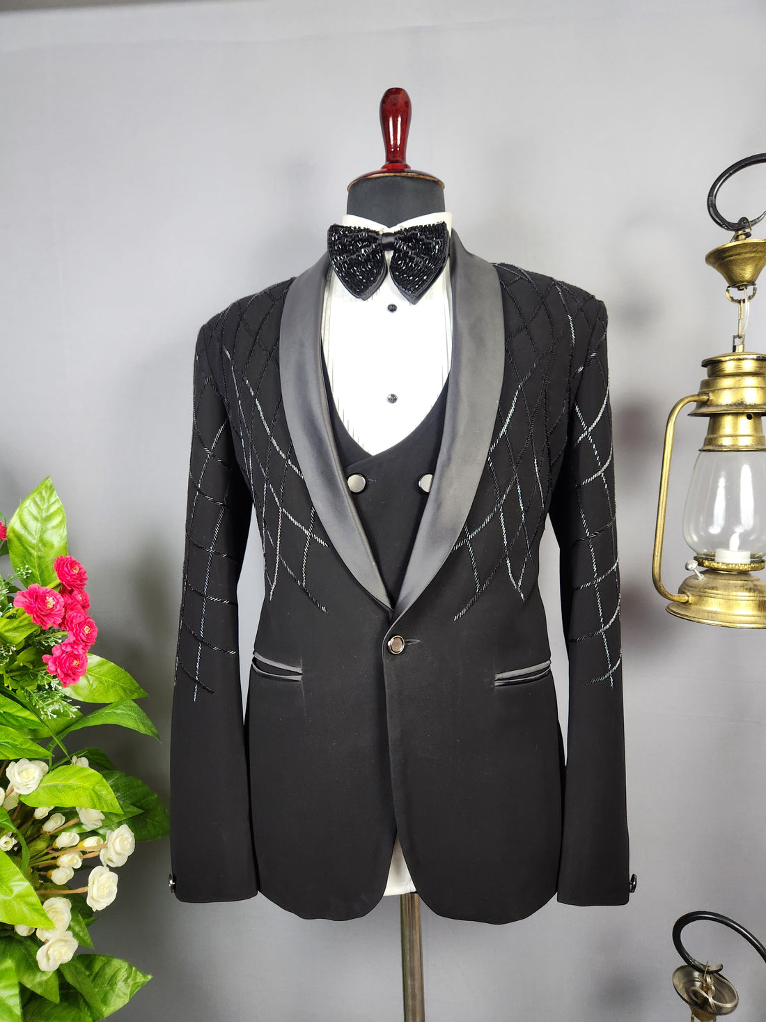 Men's black tuxedo suit for Indian groom, perfect for wedding and reception wear
